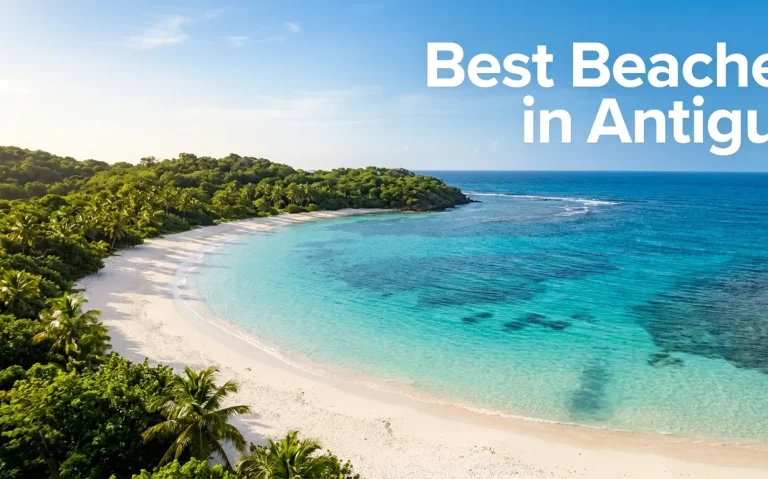 Best Beaches in Antigua aerial editorial image showing pristine white sand crescent cove with turquoise Caribbean water and tropical foliage featuring bold headline text.